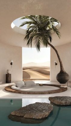 a palm tree in the middle of a living room with a pool and stone seating area