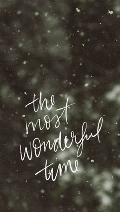 the most wonderful time written in white ink on a black and white background with snow flakes