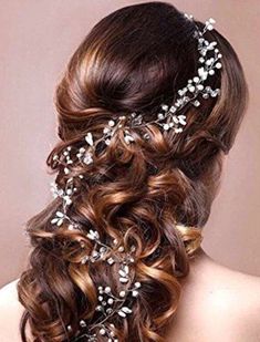 the back of a woman's head wearing a bridal hair comb