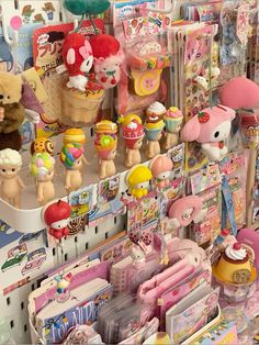 there are many toys on display in the store, including teddy bears and other items