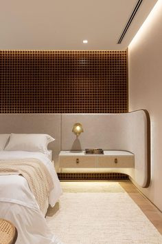 a large bed sitting under a wooden headboard in a bedroom