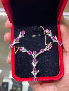 This is a beautiful handmade natural pink sapphire & diamond 18k yellow + white gold necklace and earring set. The necklace features 8 fine near flawless matching natural vivid pink sapphires stones as well as of V.S/S.i G color round and baguette diamonds. The total carat weight of the pink sapphire on this set is approximately 12.74 carats along with approximately 2 carats of diamonds. This necklace measures approximately 18.5 inches long. The screw back earrings measure approximately 1.28 inc Star Ruby Ring, Hammered Necklace, White Gold Necklace, White Gold Sapphire, Baguette Diamonds, Sapphire Pendant, White Gold Necklaces, Palm Beach Fl, Necklace And Earring Set