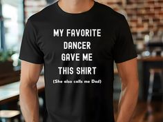 Celebrate your special bond with your favorite dancer with our charming T-shirt! This unique tee proudly serves as the ideal statement piece for any proud dancer dad. Bella Canvas Unisex T-shirt Super soft cotton and excellent quality print  ► Ribbed knit collars to bolster shaping ► Shoulders have taping for better fit over time ► Dual side seams hold the garment's shape for longer ► Runs true to size * For T-shirt Sizes Please refer to the Listing Image CARE INSTRUCTIONS: ► Machine wash: warm Relaxed Fit T-shirt For Dance With Short Sleeves, Fitted Hip Hop T-shirt For Dance, Graphic Tee T-shirt For Dance Class With Short Sleeves, Graphic Tee For Dance Class With Short Sleeves, Black Pre-shrunk T-shirt For Dance Class, Graphic Tee Short Sleeve T-shirt For Dance Class, Graphic Tee With Short Sleeves For Dance Class, Short Sleeve Black T-shirt For Dance Class, Black Short Sleeve T-shirt For Dance Class