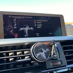 an electronic display on the dashboard of a car