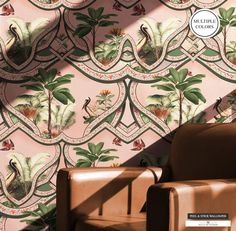 a chair sitting in front of a wallpaper with flowers and birds