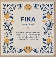 a blue and yellow floral frame with the words fika on it, in front of a