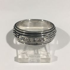 Beautiful Sterling Silver 925 Wedding Band Ring With Round Cut Brilliant Diamonds. Approximately 0.25ct. Weight: 7.2g. Width: 7.75. Size: 10. In Excellent Condition!! Formal Sterling Silver Diamond Ring With Pave Setting, Formal Sterling Silver Round Bands, Silver Band With Prong Setting For Formal Occasions, Silver Band With Prong Setting For Formal Events, Silver Bands With Prong Setting For Formal Occasions, Formal Silver Bands With Prong Setting, Silver Amethyst Ring For Formal Occasions, Silver Oval Ring With Channel Set, Silver Oval Rings With Channel Set