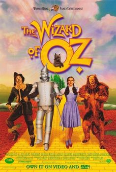 the wizard of oz movie poster with three people and an animal in front of them