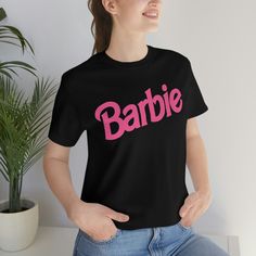 Barbie Logo Unisex Jersey Short Sleeve Tee - Etsy Barbie Logo, Co Design, Jersey Shorts, Cotton Fiber, Light Fabric, Print Quality, Ribbed Knit, Short Sleeve Tee, Adult Outfits