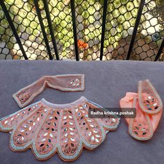 This is a set of radha krishna poshak. It includes 1 lehenga and 1 dupatta for radhaji and a dhoti with patka for krishnaji. Orange Bollywood Sets With Cutdana Details, Orange Bollywood Cutdana Sets, Bollywood Style Sets For Navratri Celebration, Celebration Saree Sets With Mirror Work, Orange Bollywood Style Sets With Gota Work, Orange Sets With Mirror Work In Traditional Drape, Bollywood Style Mirror Work Sets For Celebration, Bollywood Style Celebration Sets With Mirror Work, Festive Anarkali Set With Mirror Work For Puja