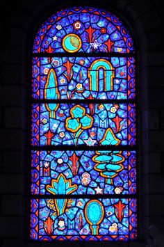 a large stained glass window inside of a building