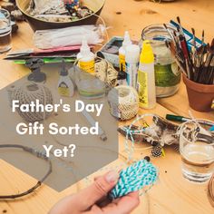 a table with craft supplies on it and the words father's day gift sorted yet?