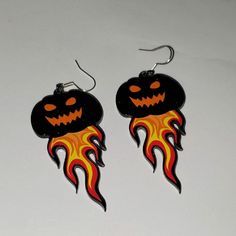 These Fun Earrings Are Handmade And Brand New. 2" Long On A Pierced Ear Wire, You Can Wear These As Part Of A Costume Or Every Day Wear. They Are Jack-O-Lanterns With Black Sparkly Heads And Flames Coming Out The Bottom. They Are A Light Weight Plastic That Will Last For Years To Come. Black Spooky Jewelry For Costume Party, Black Novelty Jewelry For Costume Party, Spooky Black Jewelry For Halloween, Spooky Black Halloween Jewelry, Spooky Handmade Earrings For Halloween, Fun Black Jewelry For Halloween, Handmade Witchy Earrings For Halloween, Handmade Spooky Halloween Earrings, Spooky Handmade Halloween Earrings