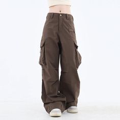 These classic-style brown pants feature a wide fit with cargo pockets Size: • S: Waist: 62cm/ 24.4 in, Length: 100cm/ 39.4 in• M: Waist: 66cm/ 26.0 in, Length: 101cm/ 39.8 in• L: Waist: 70cm/ 27.6 in, Length: 102cm/ 40.2 in• XL: Waist: 74cm/ 29.1 in, Length: 103cm/ 40.6 in• XXL: Waist: 80cm/ 31.5 in, Length: 104cm/ 40.9 inMaterial: Cotton, Polyester Brown Fall Bottoms For Streetwear, Brown Baggy Cargo Pants For Fall, Brown Wide Leg Cargo Jeans With Pockets, Brown Full Length Pants For Streetwear, Wide Leg Brown Pants For Streetwear, Brown Wide Leg Pants For Streetwear, Brown Baggy Full-length Cargo Pants, Baggy Brown Long Pants, Brown Full-length Parachute Pants For Streetwear