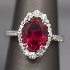 Handcrafted Rubellite Tourmaline and Diamond Cocktail Ring in 18k White Gold, October Birthstone, Vivid Pink Statement Ring, Pink Tourmaline The color is a vivid fuschia, lushly saturated and brilliant. We've nested this natural, untreated 3.86ct Brazilian rubellite tourmaline in an Art Deco inspired frame of diamonds, graduating at the ends. The diamonds are natural, E/F color and VS clarity, hand selected and total 0.63ctw. The ring has an eternally gracious appeal, looking glamorous and restr Luxury Tourmaline Jewelry With Halo Setting, Gia Certified Tourmaline Jewelry For Anniversary, Fine Jewelry Ruby Gemstones With Accents, Formal Ruby Ring With Tourmaline Accents, Formal Multi-stone Ruby Ring With Tourmaline, Formal Multi-stone Tourmaline Ruby Ring, Red Tourmaline Rings Fine Jewelry, Red Tourmaline Fine Jewelry Rings, Fine Jewelry Red Tourmaline Rings