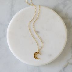 "Beautiful and lovely gold crescent moon necklace made of tiny cubic stone gold crescent moon with skinny gold plated brass chain. Soft and warm looking necklace is good for yourself or gift ! Your necklace will ship in a rudiana gift box. ♥Length 15\" - 20\" ♥Pendent 1/2\" x 1/2\" ♥Gold plated over brass / Cubic Zirconia ♥ Delivery Time Fast shipping within 1 - 3 days ♥ See more Rudiana Accessories Rudiana.etsy.com" Gold Necklace With Moon Charm For Everyday, 14k Gold Filled Necklace With Moon Charm, Everyday Gold Necklace With Moon Charm, Gold Necklace With Moon Charm In 14k Gold Filled, Dainty Gold Necklace With Moon Charm, Dainty 14k Gold Filled Crescent Necklaces, Dainty Crescent Necklace With Delicate Chain, Dainty Crescent Gold Plated Necklace, Minimalist Gold Necklaces With Moon Charm