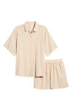 Crisp PJs with a collared short-sleeve shirt and elastic-waist shorts are ones you'll want to wear all weekend long. 26 1/2" length top; 2 1/2" inseam; 31" leg opening; 12 1/2" front rise; 16" back rise (size Medium) Top has front button closure; notched collar; short sleeves; chest patch pocket Shorts have elastic waist 55% cotton, 45% viscose Machine wash, tumble dry Imported Short Pajamas, Pocket Shorts, Elastic Waist Shorts, Notched Collar, Pajama Shorts, Shorts With Pockets, Short Sleeve Shirt, Patch Pocket, Sleeve Shirt