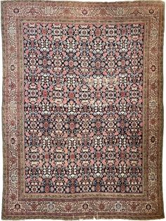 an antique rug with many different colors and patterns