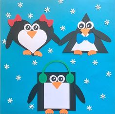 penguin paper cutouts on a blue background with snowflakes