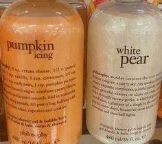 two bottles of pumpkin pie and white pear are sitting on a shelf in a store