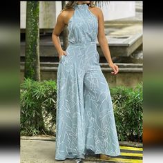 New Elegant Light Blue High Waisted Halter Jumpsuit With Wide Legs. Size Large 8/10 Bust 37.8" Length 60.3" Waist 29.9" Inseam Length 28.4" High Neck With Decorative Bow Tie At The Nape Of The Neck. Slant Pockets On Each Side. Full Zipper Back Easy To Dress Up With Heels & Jewelry, Add A Blazer For Work, Or Sandles To Dress Casual. Vintage Romper, Women Jumpsuit, Wide Leg Romper, Halter Jumpsuit, Print Jumpsuit, Jumpsuit Summer, Romper Jumpsuit, Floral Jumpsuit, Printed Jumpsuit