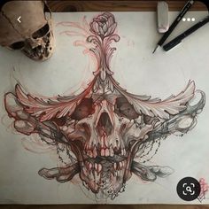 a drawing of a skull with flowers on it's head and some scissors next to it