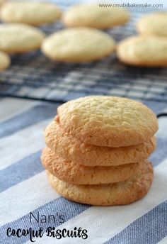 a stack of cookies sitting on top of a blue and white table cloth