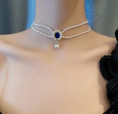 Glamorous double layering Baroque pearl bead necklace choker with sapphire blue oval shaped pendant. Classic vintage design, 100% handcrafted, every piece of the beautiful necklace takes our jewelry maker over 2 hours to carefully handmade. Exquisite details, elegant and timeless. Very eye catching gorgeous jewelry for parties, weddings, nights out, or birthdays, Valentine's Day, Mothers' Day Gifts. 💎 Features: ♥ Handmade Jewelry ♥ Finish: 14k gold plated ♥ Main Stone: faux pearl ♥ Side Stone: blue gemstone ♥ Approximate Measurements: - Whole Length: 36cm with 5cm adjustable - Pendant: 1.5 x 3 cm ♥ Lightweight, easy to wear ♥ Nickel/Lead Free, Hypoallergenic, good for sensitive skins 🎁 Packing & Shipping: ♥ All our jewelry will be shipped with beautiful gift wrap packaging ♥ Handwrite gi Blue Choker Necklace, Ethereal Jewelry, Pearl Bead Necklace, Gothic Choker, Blue Choker, Handmade Chokers, Gothic Chokers, Diy Collier, Double Layer Necklace