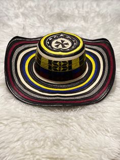 "Sombrero Vueltiao" 100% Colombian Hat 🇨🇴 Directly from the coast of Colombia Get yours today. Good for outdoor activities, the carnival or the Colombian Independence in July. You'll definitely have everyone's attention. "Sombrero Vueltiao" 100% Sombrero Colombiano 🇨🇴 Directamente desde la costa de Colombia Obtenga el suyo hoy. Bueno para actividades afuera, el carnaval o la Independencia de Colombia en Julio. Definitivamente tendrás la atención de todos. Multicolor Curved Brim Sun Hat For Rodeo, Multicolor Flat Brim Straw Hat For Rodeo, Multicolor Wide Brim Panama Hat For Festivals, Traditional Multicolor Sun Hat For The Beach, Traditional Multicolor Sun Hat For Beach, Multicolor Carnival Hats For Summer, Wide Brim Beach Hat For Cinco De Mayo, Multicolor Toquilla Straw Sun Hat For Festivals, Traditional Multicolor Wide Brim Sun Hat