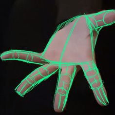 a person's hand with green lines drawn on it, in the shape of a turtle