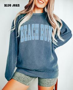 Beach Bum Sweatshirt, Comfort Colors, Varsity Letters Beach Hoodie, Tropical Spring Summer Vacation Crewneck Sweater, Beach Ocean Lover Gift SIZE UP for an OVERSIZED look (see size chart in listing photos) Our shop uses direct-to-garment printing to make our products. The design ink is sprayed on, then allowed to soak into the fibers of the garment. This process yields fine quality prints and a smooth finish on the garment. COMFORT COLORS UNISEX SWEATSHIRT Luxurious comfort and style are what this unisex, garment-dyed sweatshirt is all about. It's made with 80% ring-spun cotton and 20% polyester and the fabric is 3-end garment-dyed, ring-spun, color-blast fleece with a 100% cotton face. Each sweatshirt comes with a relaxed fit, a rolled-forward shoulder, and a back neck patch.  .: 80% ring 1989 Tv, Comfort Colors Sweatshirt, Mama Sweatshirt, Mom Sweatshirt, Comfort Color, Limassol, Positano, Oversized Sweatshirt, Looks Vintage