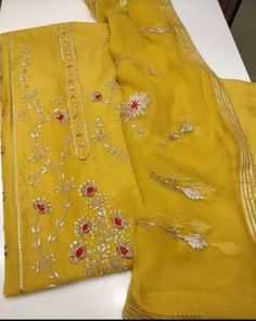 Item Overview ATHARVA Hand Embroidery Salwar Kameez/Yellow Chanderi Silk/Gota Patti Chiffon Dupatta/Custom Stitch Unstitch/Churridar/Anarkali/Gift Dno. CH1700 Fabric: * Shirt - Yellow Chanderi Silk- Hand Embroidered Neck 2.5 Mts - Beautiful Hand Embroidery * Dupatta: Chiffon Chinnon Dupatta/ All over Gota Patti Embroidery - 2.5 Mts- Latkans Tassels * Bottom Santoon Silk 2.5 Mts. (Doesn't require lining in stitching) Excusive Hand Embroidered Party Wear Punjabi Suit. Customization: * Fabrics Cust Festive Yellow Semi-stitched Salwar Kameez, Gold Kurta With Dabka Work In Georgette, Designer Gold Georgette Salwar Kameez, Festive Gold Georgette Salwar Kameez, Semi-stitched Anarkali Unstitched Suit In Gold, Semi-stitched Gold Anarkali Unstitched Suit, Traditional Yellow Semi-stitched Salwar Kameez, Gold Georgette Kurta With Zari Work, Gold Salwar Kameez With Zari Work In Georgette