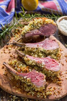 corned beef on a cutting board with herbs and seasoning next to the meat