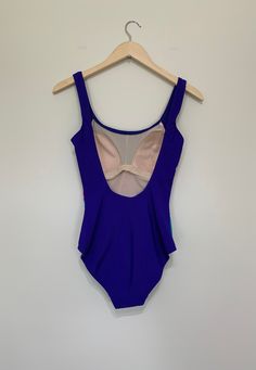 High Cut Summer Leotard With Lined Body, Stretch Sleeveless Leotard For Pool, Sleeveless Stretch Leotard For Pool, High Cut Beach Leotard For Summer, High Cut Nylon Bodysuit For Swimming, Lined Fitted Bodysuit For Poolside, Fitted Lined Bodysuit For Poolside, High Cut Nylon Swimwear With Lined Body, High Cut Lined Nylon Swimwear