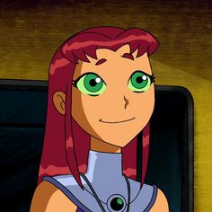 an animated woman with red hair and green eyes