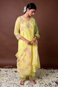 Yellow silk anarkali with placed threadwork blossom motifs on yoke and waistline gathers. Comes with pant, inner and ombre dupatta. - Aza Fashions Spring Designer Anarkali Set With Cutdana, Spring Floral Embroidered Cotton Silk Anarkali Set, Spring Anarkali Set In Cotton Silk With Traditional Drape, Spring Anarkali Cotton Silk Set, Spring Anarkali Set In Cotton Silk, Spring Cotton Silk Anarkali Set, Spring Bollywood Cotton Silk Sharara, Spring Resham Embroidered Traditional Drape Anarkali Set, Spring Bollywood Style Cotton Silk Sharara