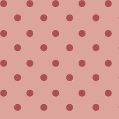 a pink background with red polka dots