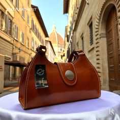 This bag has been made of the best genuine leather by local master crafters of Florence in Italy, designed for women who only accept premium Italian quality and luxury leather bags and modern Italian fashion. . Sizes: Width: 32cm/ 12.6 inches Height: 20cm/ 8 inches Depth: 12cm/ 4.7 inches . The story of this bag :  Introducing our exquisite Florence Leather Bag, a true embodiment of Italian craftsmanship and timeless elegance. Handcrafted with utmost care in the heart of Florence, Italy, this bag is a masterpiece that seamlessly combines style, functionality, and luxury. Imagine strolling through the charming streets of Florence, feeling the warm Mediterranean breeze against your skin. As you delve deeper into the city's rich history and artistic heritage, you can't help but notice the pas Handmade Leather Bags, Luxury Leather Bag, Brown Shoulder Bag, Leather Bags Handmade, Leather Bags, Handmade Leather, Italian Fashion, Full Grain Leather, Leather Handmade