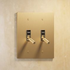 two light switch plates on the wall with one being turned off