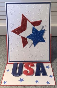 a patriotic card with stars and the word usa in red, white, and blue