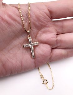 "Cubic Zirconia Cross Necklace Beautiful Cross 18k gold plating with zirconia encrusted. The cross measures 1.2 x 0.75 inch or 3 x 1.9 cm box 1mm chain. Details: 18K Gold Plated Pendant and chain Spring-ring clasp for closure Length 17.5\" inches or 45 cm It looks great alone or layering with other necklaces. It is carefully shipped in a beautiful organza pouch, bubble wrapped and well protected. A lot of my jewelry is made with silver plated and gold plated solid brass or any other metal. It wi Gold Cubic Zirconia Crucifix Necklace, Gold Cubic Zirconia Pendant Cross Necklace, Yellow Gold Cubic Zirconia Crucifix Jewelry, Gold Cross Necklace With Cubic Zirconia, Yellow Gold Crucifix Jewelry With Cubic Zirconia, Crucifix Necklace With Vvs Clarity As Gift, Gift Crucifix Necklace Vvs Clarity, Gift Crucifix Necklace With Vvs Clarity, Gold Diamond Crucifix Jewelry