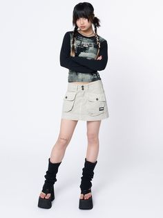 If I can’t wear my cargo mini skirt, then I’m RSVP’ing no… Cargo mini skirt in beige Utility front pockets Zip fly with button fastening Low rise waist Belt loops 100% cotton Shy wears size 24" and is 152 cm | 4'12" tall Trending Skirts, Khaki Skirt Outfits, Skirts Cargo, Acubi Aesthetic, Cargo Design, Cargo Outfit, Minga London