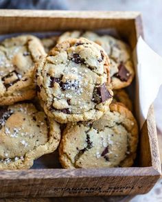 a wooden box filled with chocolate chip cookies