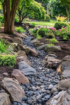 a garden with lots of rocks and trees