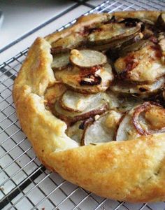 a pizza sitting on top of a metal rack