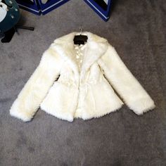 This Is A Gorgeous Never Worn Ivory Fur Jacket With Cinched Waist. Looks Beautiful Dressed Up Or With Jeans. Never Worn And Comes With Extra Buttons. Size Small Modacrylic, Acrylic, Polyester Elegant Cream Outerwear With Faux Fur Lining, White Outerwear With Faux Fur Trim For Fall, White Faux Fur Trim Outerwear For Fall, Chic White Outerwear With Faux Fur Lining, Elegant Cream Fur Coat For Spring, Fitted Cream Fur Coat For Fall, Cream Fur Coat With Faux Fur Trim For Spring, Cream Fitted Fur Coat For Fall, Fitted White Fur Coat For Spring