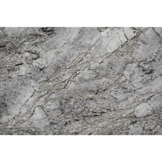 a close up view of a marble countertop with grey and white veining on it