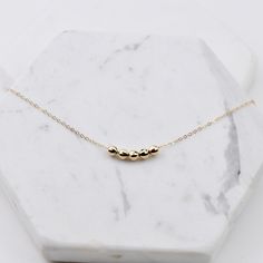 Friendship necklace. Friendship gift. Delicate mirror beads necklace. The necklace will be shipped in a beautiful gift box. ★ 14K yellow gold mirror ball bead is 4mm. ★ Necklace is 14K yellow gold 1.2mm flat cable chain. Please read our policies before you place your order. https://www.etsy.com/shop/SashJewelry/policy?ref=shopinfo_policies_leftnav To see other Mother daughter necklace set click here: https://www.etsy.com/shop/SashJewelry?section_id=12441134&ref=shopsection_leftnav_1 To see o Rose Gold Charm Necklace For Mother's Day, Mother's Day Rose Gold Charm Necklace With Locket, Mother's Day Rose Gold Tarnish-resistant Charm Necklace, Mother's Day 14k Gold-filled Charm Necklaces With Delicate Chain, Hypoallergenic 14k Rose Gold-filled Necklaces, Mother Daughter Necklaces Set, Other Mother, Simple Pearl Necklace, Necklace Friendship