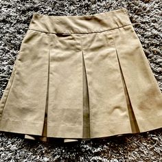 School Uniform Tan Pleated Skirt, Shorts, Side Zipper With A Pocket. Juniors Size 5, Measures 19 “ From The Waistband To The Hem, 15” At The Waistband As Pictured. New Without Tags, Never Worn. Cute Khaki Shorts, Tan Skirt Outfits, Tan Pleated Skirt, School Uniform Skirts, Uniform Skirt, Tan Skirt, Khaki Skirt, Skirt Shorts, Jersey Outfit