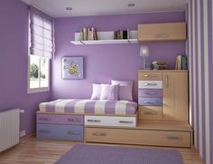 a bedroom with purple walls and white furniture